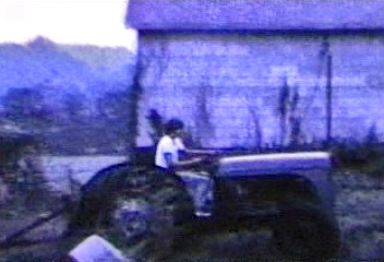 Farm Tractor and the two cousins in video.